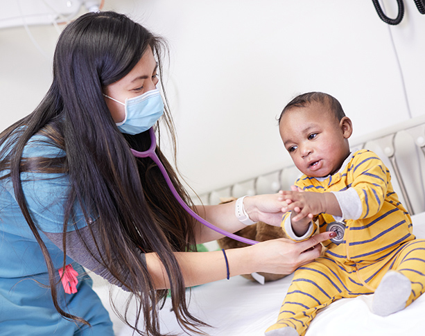 UMC Nurse using stethoscope on child patient
